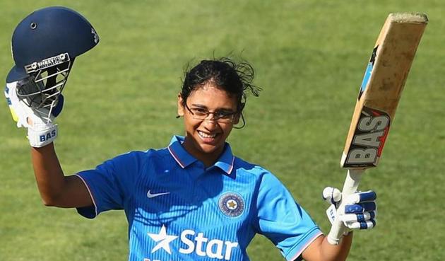 Smriti Mandhana of India celebrates after reaching her century against Australia at Blundstone Arena.(Getty Images)