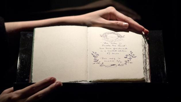 One of only seven copies of a handwritten and illustrated book by British author JK Rowling titled The Tales of Beedle the Bard is on show at Sotheby's auction house in London. (AFP) One of only seven copies of a handwritten and illustrated book by British author JK Rowling titled The Tales of Beedle the Bard is on show at Sotheby's auction house in London. (AFP)