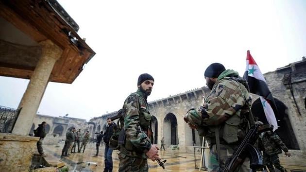 Forces loyal to Syria's President Bashar al-Assad stand inside the Umayyad mosque in the government-controlled area of Aleppo. (Reuters) Forces loyal to Syria's President Bashar al-Assad stand inside the Umayyad mosque in the government-controlled area of Aleppo. (Reuters)