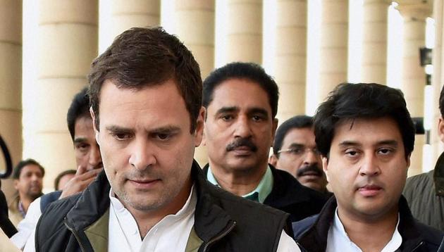 Congress vice-president Rahul Gandhi, along with party leader Jyotiraditya Scindia, walks to address a press conference at Parliament in New Delhi on Wednesday.(PTI)