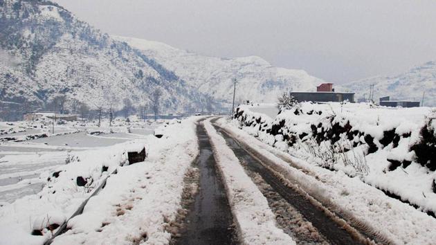 The Mughal Road which connects Rajouri & Poonch districts in the Jammu region with Shopian district is covered with snow after fresh snowfall on Sunday. (PTI)