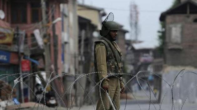 A paramilitary soldier stands guard near a barricade during curfew in Srinagar in July 2016, days after militant commander Burhan Wani was killed in an encounter. (Waseem Andrabi / HT File Photo) A paramilitary soldier stands guard near a barricade during curfew in Srinagar in July 2016, days after militant commander Burhan Wani was killed in an encounter. (Waseem Andrabi / HT File Photo)