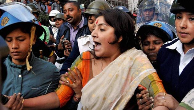 Actress turned BJP leader Locket Chatterjee being detained by police during protest rally against "Fatwa" issued by Shahi Imam of Tipu Sultan Mosque, Maulana Noor-ur Rahman Barkati against Dilip Ghosh, State BJP President in Kolkata on Thursday. (PTI Photo) Actress turned BJP leader Locket Chatterjee being detained by police during protest rally against "Fatwa" issued by Shahi Imam of Tipu Sultan Mosque, Maulana Noor-ur Rahman Barkati against Dilip Ghosh, State BJP President in Kolkata on Thursday. (PTI Photo)