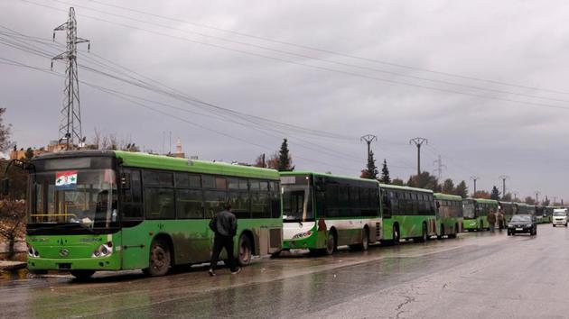 Buses wait to evacuate people from a rebel pocket in Aleppo, in the government-controlled al-Hamadaniah Stadium of Aleppo, Syria December 14. (Reuters) Buses wait to evacuate people from a rebel pocket in Aleppo, in the government-controlled al-Hamadaniah Stadium of Aleppo, Syria December 14. (Reuters)