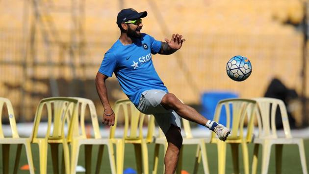 India's captain Virat Kohli plays football with teammates. (AFP)