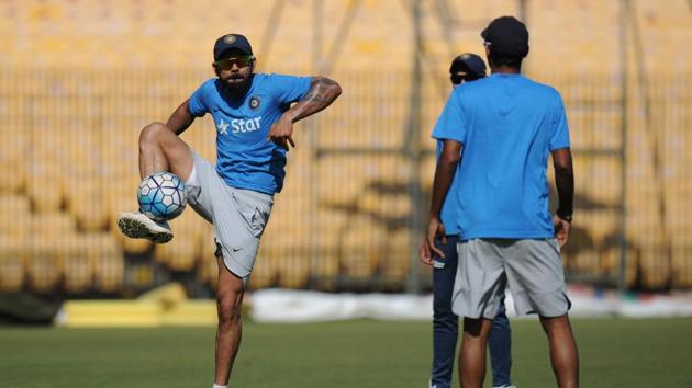 Indian captain Virat Kohli plays with teammates during a training session. (AFP)