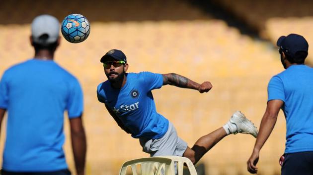 Indian captain Virat Kohli warms up with teammates during a training session ahead of the fifth cricket Test match between India and England. (AFP)