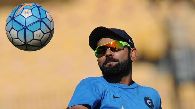 Indian captain Virat Kohli plays football during a training session ahead of the fifth cricket Test match between India and England.(AFP)