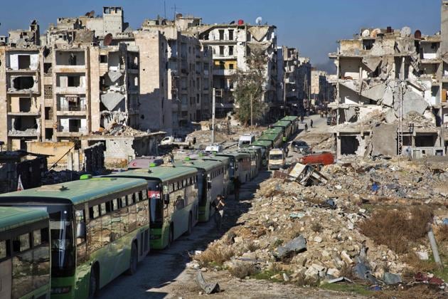 Buses line up during the evacuation. (AFP)