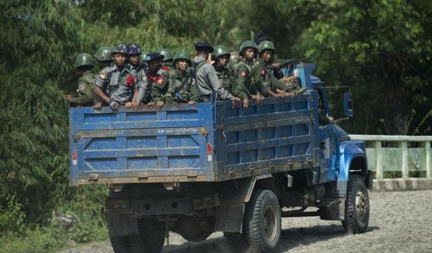 Armed military troops and police force travelling in trucks through Maungdaw, located in Rakhine State, home of the minority Rohingya community. (AFP file) Armed military troops and police force travelling in trucks through Maungdaw, located in Rakhine State, home of the minority Rohingya community. (AFP file)