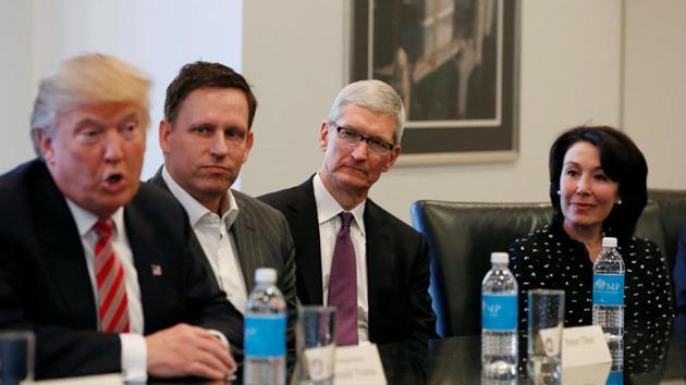 US President-elect Donald Trump speaks as (2nd L to R) PayPal co-founder and Facebook board member Peter Thiel, Apple Inc CEO Tim Cook and Oracle CEO Safra Catz look on during a meeting with technology leaders at Trump Tower in New York. (Reuters Photo) US President-elect Donald Trump speaks as (2nd L to R) PayPal co-founder and Facebook board member Peter Thiel, Apple Inc CEO Tim Cook and Oracle CEO Safra Catz look on during a meeting with technology leaders at Trump Tower in New York. (Reuters Photo)