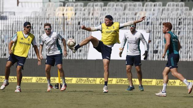 England's Jos Buttler, center, plays football with other cricketers to warm up during a practice session. (AP) England's Jos Buttler, center, plays football with other cricketers to warm up during a practice session. (AP)