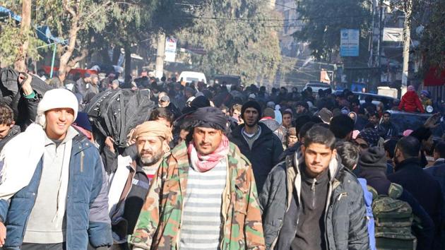 People gather to be evacuated from a rebel-held sector of eastern Aleppo. (REUTERS)