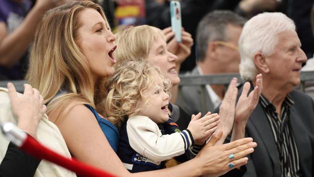 Applauding with daughter James. (Chris Pizzello/Invision/AP)