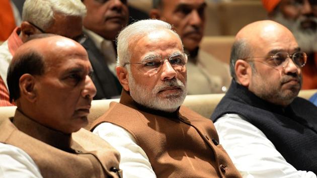 PM Narendra Modi, home minister Rajnath Singh and BJP president Amit Shah look on during the BJP's parliamentary committee meeting at Parliament House in New Delhi.(AFP Photo)