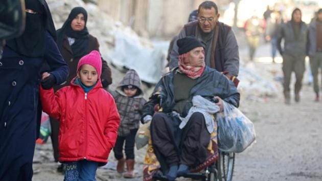 People walk as they gather to be evacuated from a rebel-held sector of eastern Aleppo, Syria December 15, 2016. (Reuters)