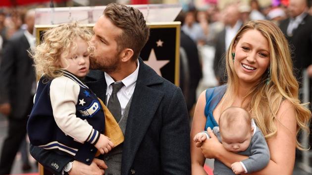Actors Ryan Reynolds and Blake Lively pose with their daughters as Ryan Reynolds is honoured with star on the Hollywood Walk of Fame on December 15, 2016. (AFP)
