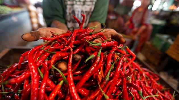 A trader displays chilis for sale at a traditional market in Jakarta, Indonesia, on December 16, 2016. (Reuters) A trader displays chilis for sale at a traditional market in Jakarta, Indonesia, on December 16, 2016. (Reuters)