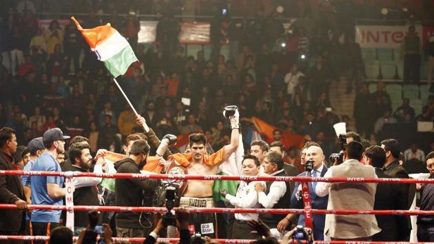 Baba Ramdev led a group of celebrities and stormed into the ring to hug and congratulate Vijender Singh on his victory.(IOS)