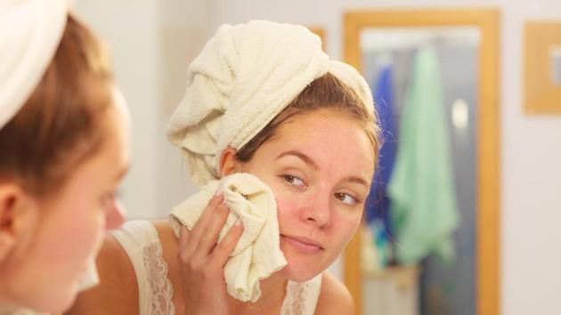 Wash your face once or twice a day with a mild cleanser and lukewarm water, especially before going to bed to remove makeup and dirt. Avoid scrubbing or using harsh abrasive products. (Shutterstock) Wash your face once or twice a day with a mild cleanser and lukewarm water, especially before going to bed to remove makeup and dirt. Avoid scrubbing or using harsh abrasive products. (Shutterstock)