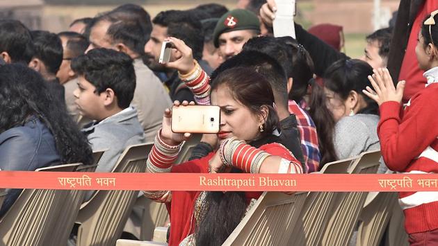 An audience takes pictures during the  Change of Guard Ceremony.  (Raj K Raj/HT PHOTO) 
