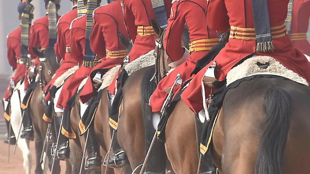 The New Guard, accompanied by the band  marches off to take up their duties during the Change of Guard's Ceremony at Rashtrapati Bhavan in New Delhi. The day’s ceremony ends with an equestrian display by the PBG before they ride away towards the Rashtrapati Bhavan and with the playing of the National Anthem. (Raj K Raj/HT PHOTO) 
