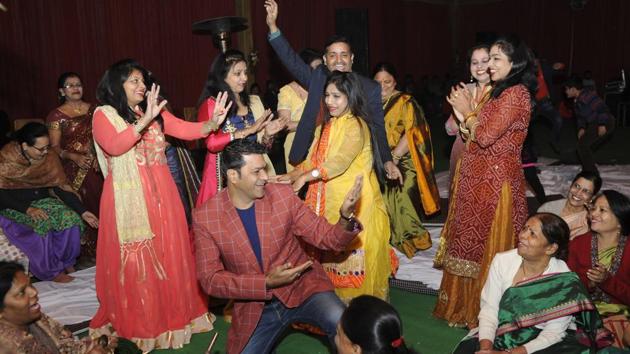 Women dance during the Sangeet ceremony prior to the mass wedding at Ramlila ground, in Noida. (Sunil Ghosh  / HT photo) 