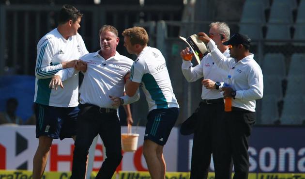 Umpire Paul Reiffel being helped by support staff after a throw from India’s Bhuvneshwar Kumar hit him on the head during the fourth India-England Test. (REUTERS) Umpire Paul Reiffel being helped by support staff after a throw from India’s Bhuvneshwar Kumar hit him on the head during the fourth India-England Test. (REUTERS)