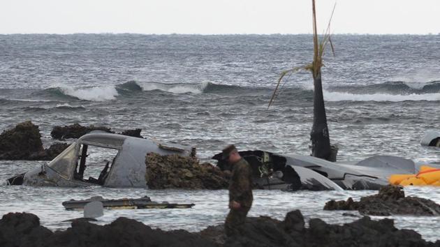 The wreckage of a US Marine MV-22 Osprey tilt-rotor aircraft on the coast of Nago, Japan's southern island of Okinawa on December 14, after it crash-landed late on December 13. Five crew members aboard the MV-22 Osprey were injured after the aircraft suffered a "mishap" and landed in shallow water, the Pentagon said. (AFP / JIJI PRESS ) The wreckage of a US Marine MV-22 Osprey tilt-rotor aircraft on the coast of Nago, Japan's southern island of Okinawa on December 14, after it crash-landed late on December 13. Five crew members aboard the MV-22 Osprey were injured after the aircraft suffered a "mishap" and landed in shallow water, the Pentagon said. (AFP / JIJI PRESS )