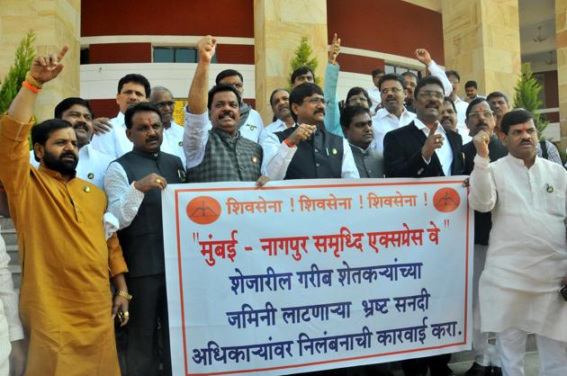 Shiv Sena MLAs protest against the alleged land grab outside the Vidhan Bhavan in Nagpur on Friday.(SUNNY SHENDE)