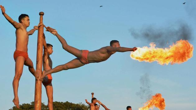 The army's Maratha Light Infantry Regiment soldiers show their 'Malkhamb' skills at a rehearsal for the Vijay Diwas celebrations in Karad, Maharashtra on December 13. (PTI) The army's Maratha Light Infantry Regiment soldiers show their 'Malkhamb' skills at a rehearsal for the Vijay Diwas celebrations in Karad, Maharashtra on December 13. (PTI)