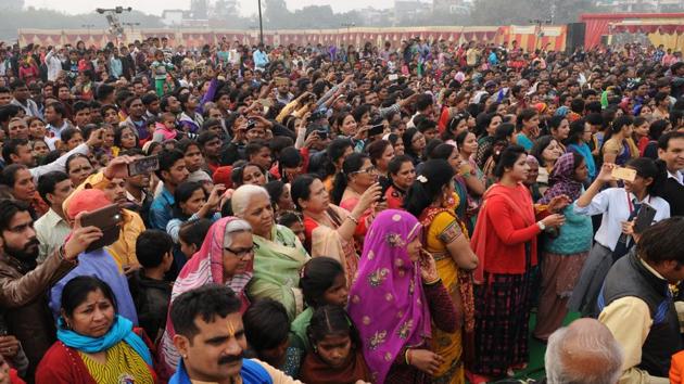 Friends, family and well-wishers in attendance record the ceremony conducted for over 70 couples on Saturday.  (Burhaan Kinu/HT PHOTO) 