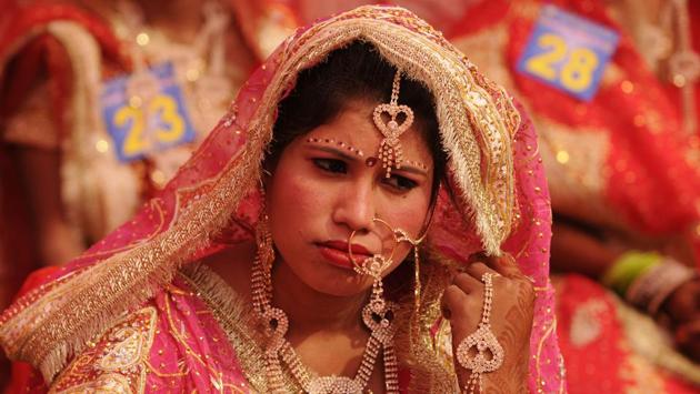 One of the brides, all decked up. The organisation has been holding community marriages for underprivileged couples in the past as well. (Burhaan Kinu/HT PHOTO) 