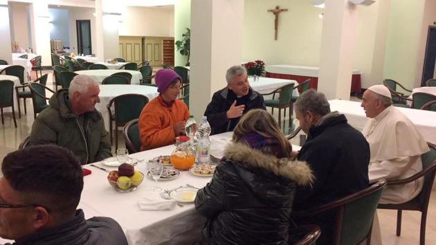 Pope Francis, right, flanked at right by Mons. Konrad Krajewski, celebrates his 80th birthday sharing a breakfast with homeless people before celebrating Mass with cardinals at the Vatican, Saturday Dec. 17, 2016. (AP Photo) Pope Francis, right, flanked at right by Mons. Konrad Krajewski, celebrates his 80th birthday sharing a breakfast with homeless people before celebrating Mass with cardinals at the Vatican, Saturday Dec. 17, 2016. (AP Photo)
