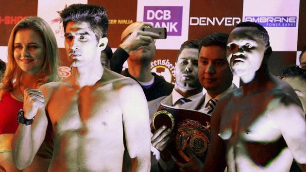 Indian boxing star Vijender Singh (left) and Francis Cheka, current intercontinental Champion, at a news conference on the eve of their fight in New Delhi on December 16. (Atul Yadav / PTI) Indian boxing star Vijender Singh (left) and Francis Cheka, current intercontinental Champion, at a news conference on the eve of their fight in New Delhi on December 16. (Atul Yadav / PTI)
