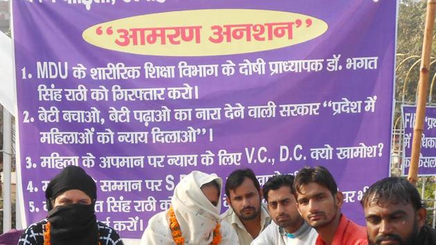 The complainants, along with their supporters, have been sitting on a dharna at Ambedkar Chowk in Rohtak for past three days, protesting police inaction. (HT Photo) The complainants, along with their supporters, have been sitting on a dharna at Ambedkar Chowk in Rohtak for past three days, protesting police inaction. (HT Photo)