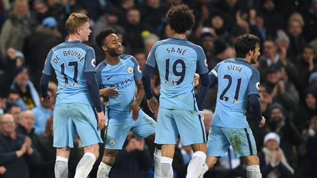 Manchester City's English midfielder Raheem Sterling (2nd L) celebrates with teammates after scoring their second goal during the English Premier League football match between Manchester City and Arsenal at the Etihad Stadium. (AFP) Manchester City's English midfielder Raheem Sterling (2nd L) celebrates with teammates after scoring their second goal during the English Premier League football match between Manchester City and Arsenal at the Etihad Stadium. (AFP)