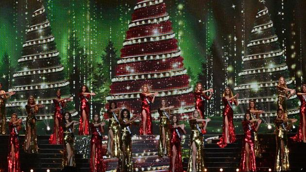 Contestants perform on stage in one of the initial rounds. (AFP) 