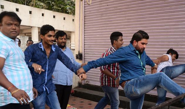 The incident angered locals with around 80 activists from political parties taking down hoardings and breaking railings and shutters at the centre (Bachchan Kumar) The incident angered locals with around 80 activists from political parties taking down hoardings and breaking railings and shutters at the centre (Bachchan Kumar)