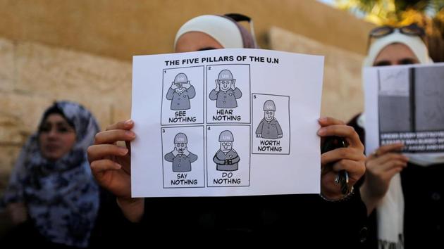 Protesters take part in a sit-in, in solidarity with the people of Aleppo against the Syrian regime, in front of the UNDP office in Amman, Jordan. (Muhammad/Reuters Photo) 