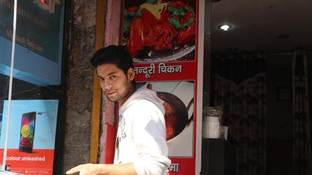The moment we spotted Majid making biryani at a shop in east Delhi, we knew he was model material. Majid thought it was a joke when we told him that we wanted to do a shoot with him. He is not used to attention. Despite his good looks, height and physique, customers address him as ‘oye chhotu’. ‘Chal ek plate biryani laga’ is what he gets to hear throughout the day. (Shara Ashraf/HT Photo) 