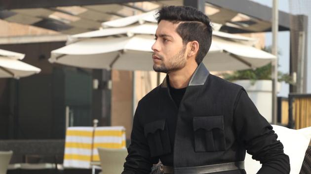 He  exuded royalty in  a black Shantanu and Nikhil outfit.  (Shara Ashraf/HT Photo( styling- akshay kaushal)) 