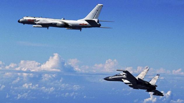 Chinese People's Liberation Army Air Force Su-30 fighter, right, flies along with a H-6K bomber. (AP File Photo) Chinese People's Liberation Army Air Force Su-30 fighter, right, flies along with a H-6K bomber. (AP File Photo)