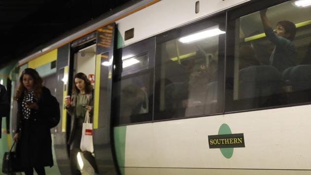 Travellers leave a train at Victoria Station in London on December 19, 2016. Members of the RMT union are on strike, affecting services on the Southern Rail region on Monday and Tuesday. (AP) Travellers leave a train at Victoria Station in London on December 19, 2016. Members of the RMT union are on strike, affecting services on the Southern Rail region on Monday and Tuesday. (AP)