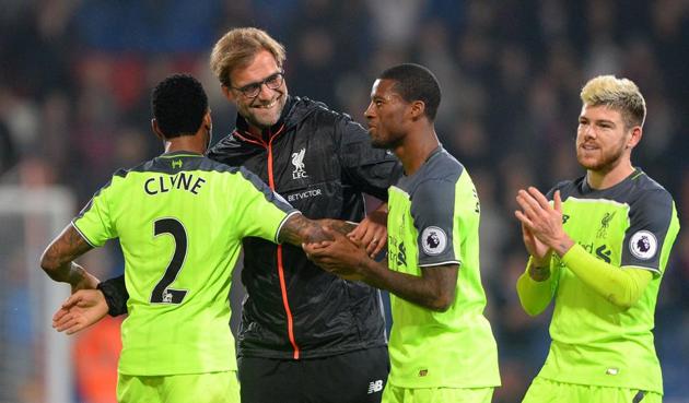 Liverpool manager Jurgen Klopp, 2nd left, celebrates with team members after their Premier League match against Crystal Palace. (AP) Liverpool manager Jurgen Klopp, 2nd left, celebrates with team members after their Premier League match against Crystal Palace. (AP)