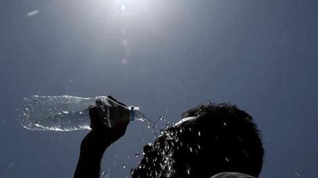 A man pours water on his face during a hot summer day in Hyderabad. (AP Photo) (AP File Photo) A man pours water on his face during a hot summer day in Hyderabad. (AP Photo) (AP File Photo)
