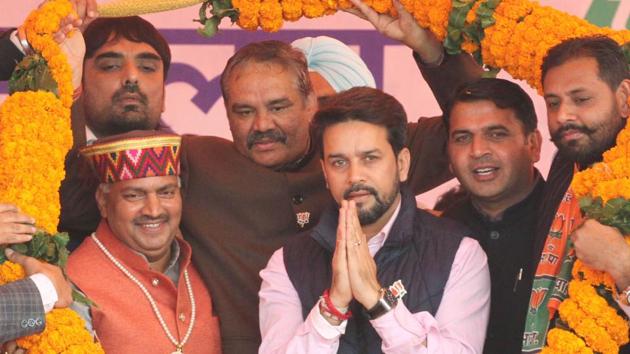 Vijay Sampla, minister of state for social justice and empowerment and (center) Anurag Thakur, member of Lok Sabha from Hamirpur in Himachal Pradesh with party supporters during the BJYM Rally at grain market on Jalandhar Bypass in Ludhiana on Sunday. (Jagtinder Singh Grewal / HT Photo)