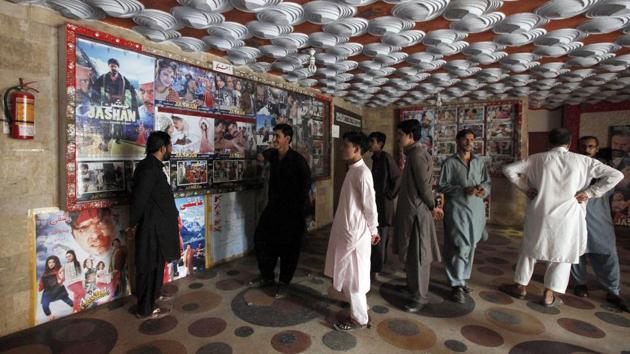 Pakistani cinema-goers look at photos displayed at a hall in Karachi on December 18, 2016. A Pakistan Film Exhibitors Association official said cinema owners had decided to resume screening Indian movies after a two-month self-imposed ban. (AP) Pakistani cinema-goers look at photos displayed at a hall in Karachi on December 18, 2016. A Pakistan Film Exhibitors Association official said cinema owners had decided to resume screening Indian movies after a two-month self-imposed ban. (AP)