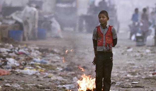 A boy stands near a heap of garbage in Anand Vihar. The National Green Tribunal said municipal solid waste is one of the most serious pollutants in Delhi. (Ravi Choudhary/HT Photo) A boy stands near a heap of garbage in Anand Vihar. The National Green Tribunal said municipal solid waste is one of the most serious pollutants in Delhi. (Ravi Choudhary/HT Photo)