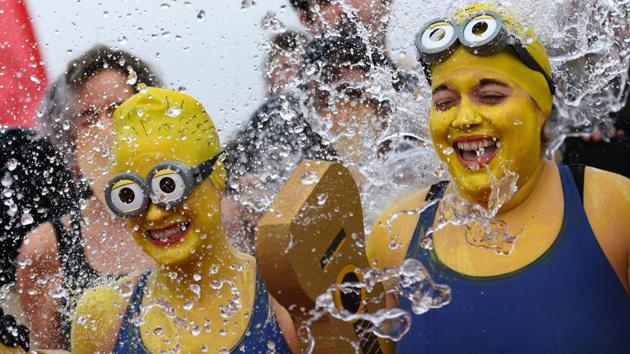 Participants celebrate the 78th "Coupe de Noel" (Christmas cup), an annual swimming race in cold water in Lake Geneva, Switzerland. (Fabrice Coffrini/AFP) Participants celebrate the 78th "Coupe de Noel" (Christmas cup), an annual swimming race in cold water in Lake Geneva, Switzerland. (Fabrice Coffrini/AFP)